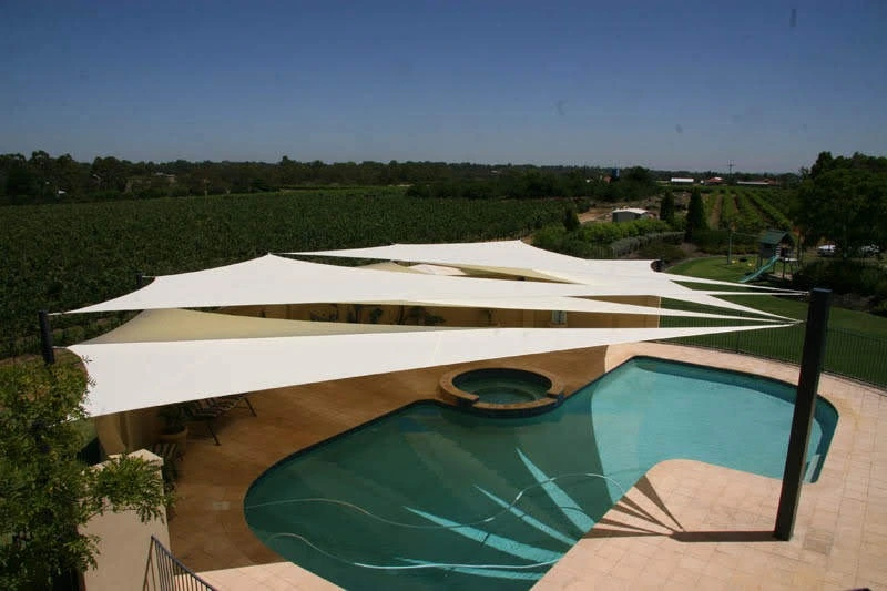 Img20190910wa0046 archilexis | premium tensile structure manufacturer Outdoor Pool with a Circular Spa Beige Deck and White Sail Shade Structures Overhead